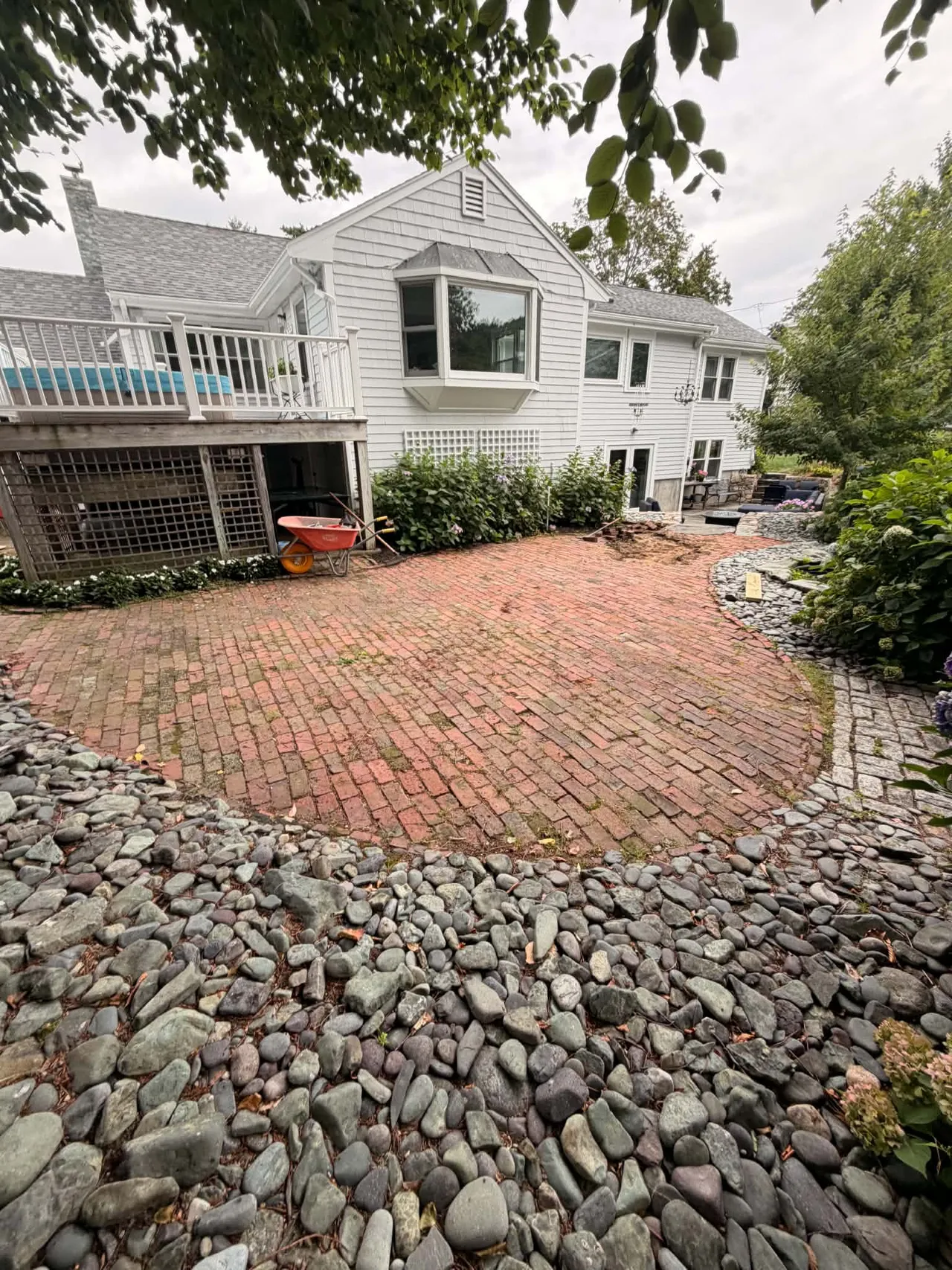Backyard brick surface before artificial grass installation