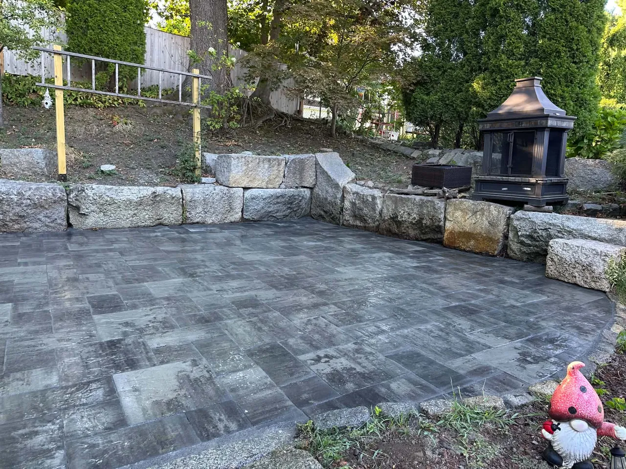 Paver patio with natural stone border