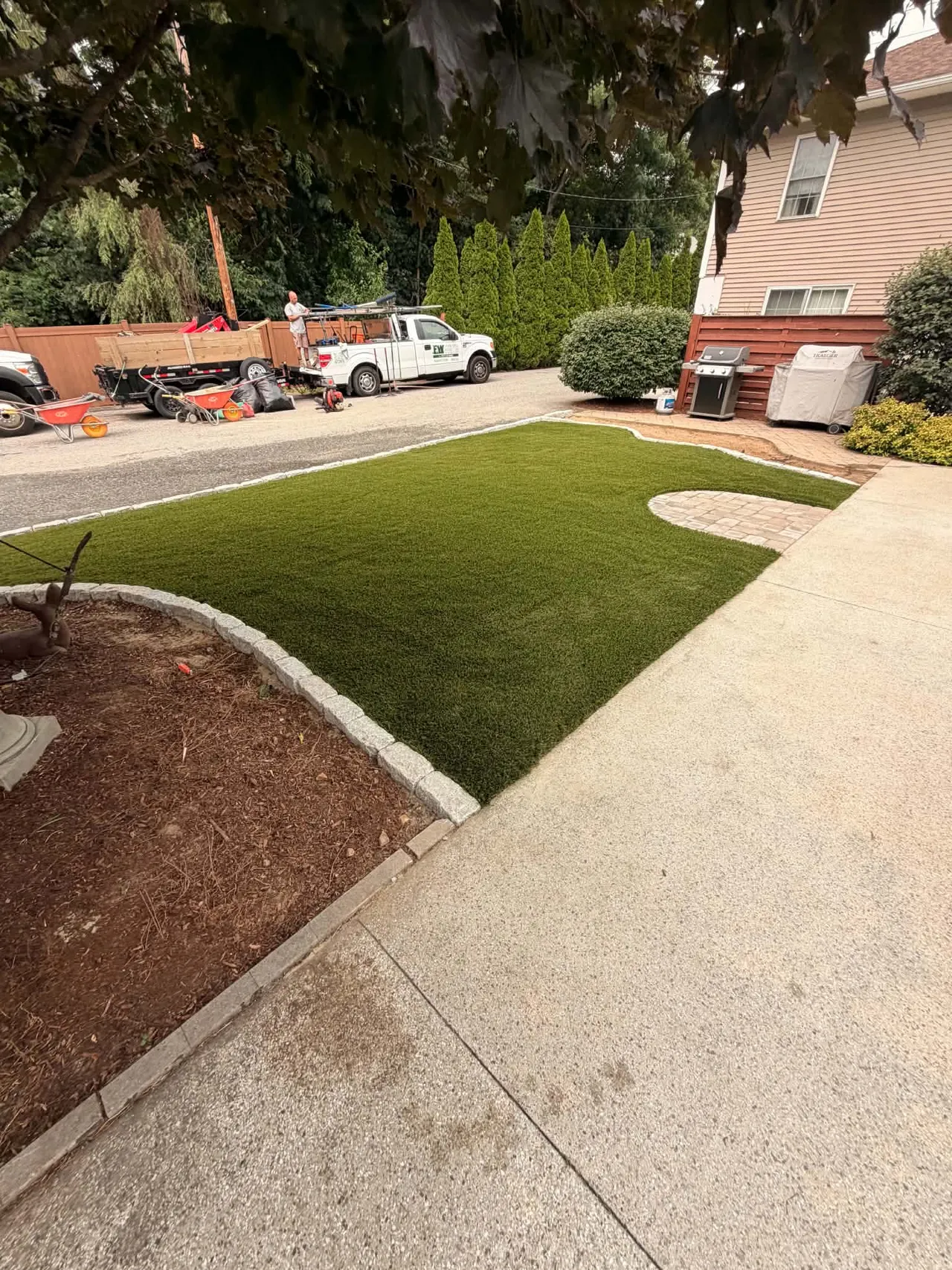Installed artificial grass with stone edging